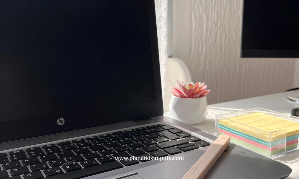 Laptop with a pencil and sticky notes