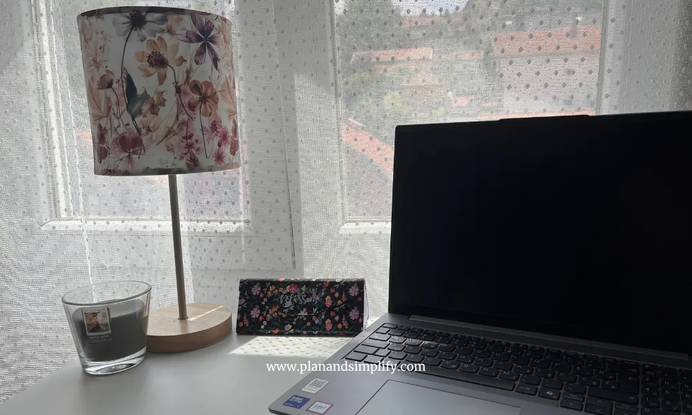 A desk with a lamp, laptop and candle - perfect wfh aesthetic